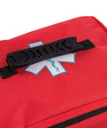 Red emergency medical kit bag with Star of Life patch and black plastic top-handle clip