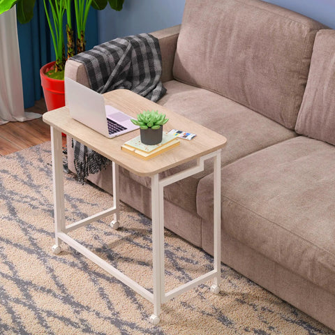 23.6 Inch Mobile Rolling Computer Desk With Wheels Folding Laptop Cart Table For Small Spaces Portable Home Office Desk On Casters Natural And White Finish next to a couch