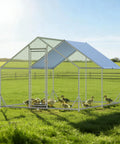 Heavy Duty Walk In Chicken Coop With Peak Roof And Waterproof Cover 13 By 9.8 By 6.4 Feet Poultry Enclosure in a field with ducks inside