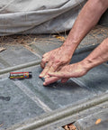 Person using Two Ounce Epoxy Putty Stick That Delivers A Fast Hardcore Waterproof Bond For Cars Boats Plumbing And Home Repairs Cures Dark Gray Heat Resistant Up To 350 Fahrenheit Holds Four Tons Chemical And Fuel Resistant on metal surface