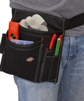 Five Pocket Single Side Tool Belt Pouch And Work Apron With Durable Canvas Construction Adjustable Belt For Custom Fit Black Hands Free Tool Carry And Quick Access On The Job Site shown on person