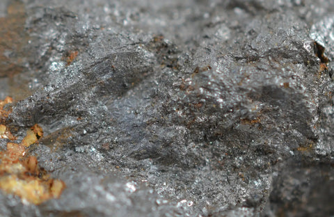 Close-up of Lodestone Specimen about 1 inch natural magnetic rock for classroom demos, showing metallic surface