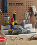 Sleek Three Tier Cabinet Organizer That Straight Up Fixes Pantry Chaos, Non Skid Storage Rack For Spices Seasonings And Canned Goods, White Gray Kitchen Shelf shown in workshop with tools and jars.