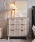 Set Of Two Fluted Nightstands Featuring Three Spacious Drawers And Clean White Alder Finish in a styled bedroom setting.