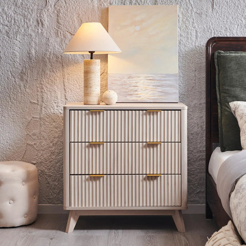 Set Of Two Fluted Nightstands Featuring Three Spacious Drawers And Clean White Alder Finish in a styled bedroom setting.