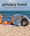 Person using Outdoor Laptop Sun Shade For Working Anywhere Glare Blocker And Heat Reflective Hood on beach.