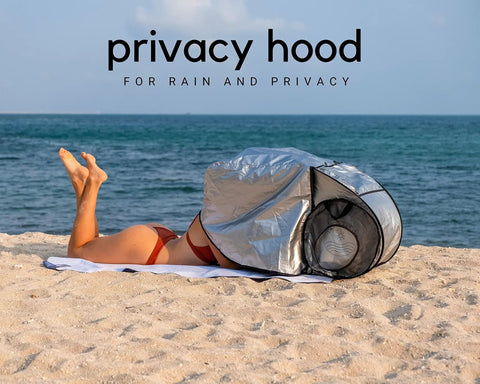 Person using Outdoor Laptop Sun Shade For Working Anywhere Glare Blocker And Heat Reflective Hood on beach.