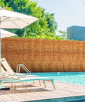 Reed Fencing Rolls 6 Ft By 16.4 Ft Natural Reed Screen Curtain For Outdoor Privacy And Shade by poolside in garden