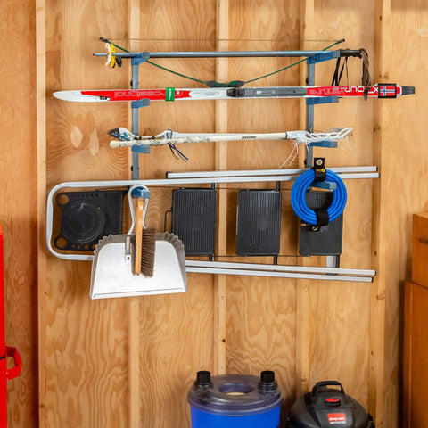 Four Tier Lumber Rack Wall Mounted Shop Organizer For Garage And Basement, holding skis and tools, on wooden wall in garage