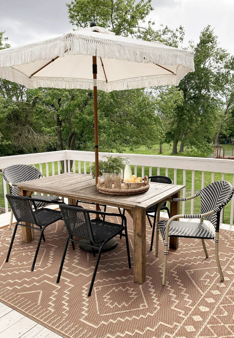 Outdoor Waterproof Plastic Straw Rug 8x10, Reversible Lightweight Carpet For RV Camping, Backyard Beach Picnic, Portable Outdoor Mat For Balcony And Patio, Easy Clean And Quick Dry Beige And Brown on a patio