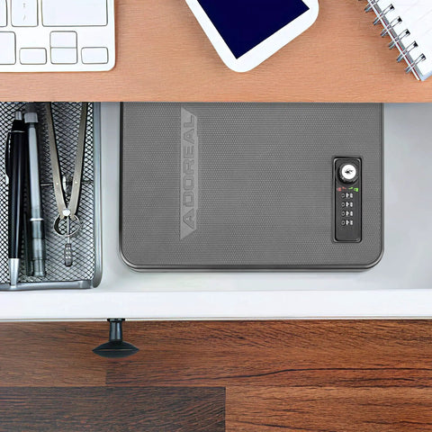 Small Pistol Safe Portable Handgun Case With 4 Digit Lock for Quick Access next to office supplies in a drawer.