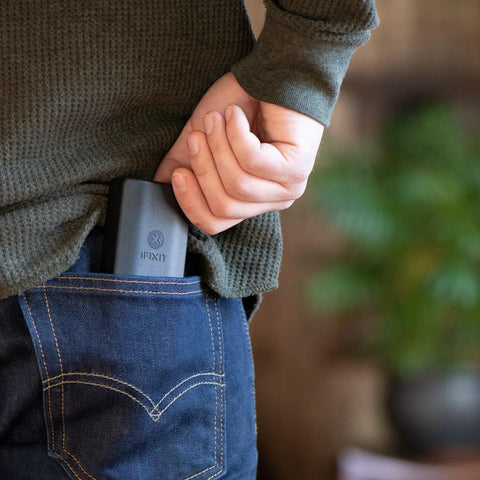 Person placing Minnow Driver Kit Pocket Sized Screwdriver And Portable Bit Set For On The Go Fixes into jeans back pocket