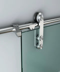 Close-up of 12 Ft Stainless Steel Glass Double Bi Partition Sliding Barn Door Hardware Kit with rollers and track installed on glass door.