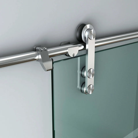 Close-up of 12 Ft Stainless Steel Glass Double Bi Partition Sliding Barn Door Hardware Kit with rollers and track installed on glass door.