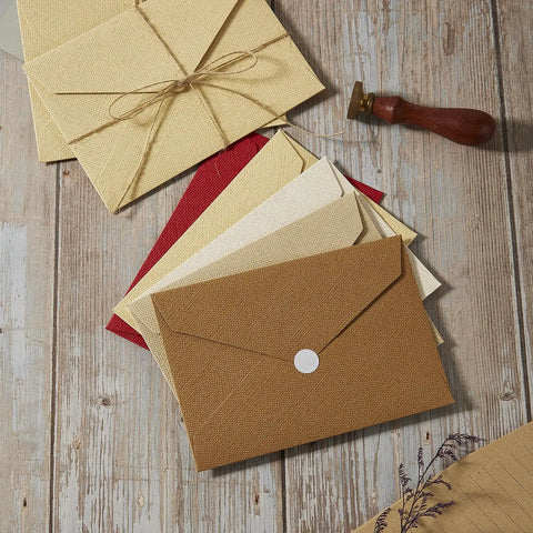 Rustic Ivory White Letter Set With Jute String Seals, 20 Premium Writing Papers And 10 Heavyweight Envelopes displayed on wood