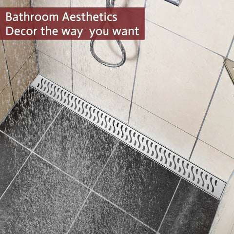 Transform Your Bathroom Game With This Rock Solid 24 Inch Linear Shower Drain Featuring A Brushed Nickel Finish And Serious Flow Capability For Quick Drain Action, installed in a shower with water flowing over it.