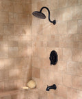 Hanover Rainfall Shower Head In Tuscan Bronze, Large Wide Coverage, installed in a tiled shower.
