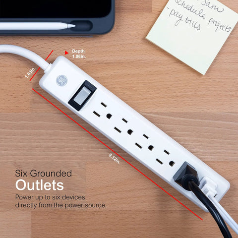 Six Outlet Power Strip Four Pack With Two Foot Extension Cords For Home Office Garage Heavy Duty Flat Plug Grounded With Integrated Circuit Breaker 3 Prong Wall Mount UL Listed White on desk.