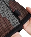 Close-up of hand holding see-through Black Nylon Mesh Zipper Pouches Set Of Five for organizing travel essentials.