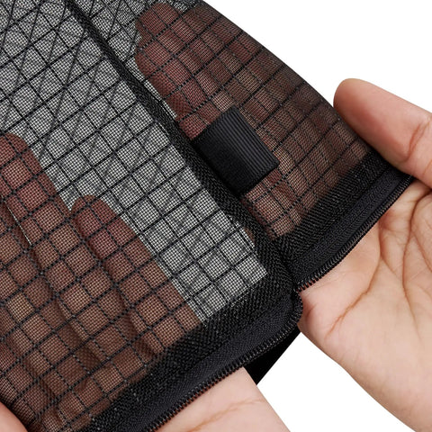 Close-up of hand holding see-through Black Nylon Mesh Zipper Pouches Set Of Five for organizing travel essentials.