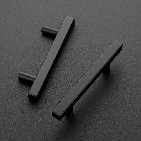 Two matte black stainless steel 5 inch square cabinet pulls on a dark surface, 30 Pack 5 Inch Square Cabinet Pulls Matte Black Stainless Steel Kitchen Drawer Pulls Cabinet Handles 5 Inch Length With 3 Inch Center To Center Hole Spacing For Seamless Replacement And Modern Cabinet Update.