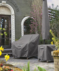 Water Resistant 24 Inch Round Patio Ottoman and Table Cover, Heavy Duty Outdoor Furniture Shield in garden setting