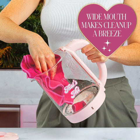 Woman cleaning Pink Glass Electric Kettle 1.8 Liter With 1100 Watt Fast Boil Auto Shut Off Boil Dry Protection Led Indicator