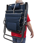 Person carrying Legz Up Lounger Outdoor Folding Chair With Multi Position Recline Legs Up Or Down Comfort on their back