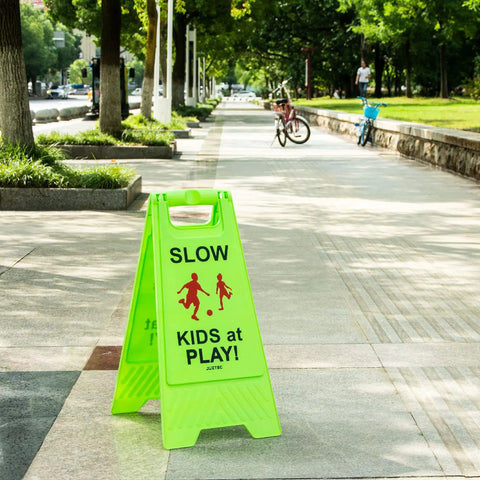 Bright Green Slow Down Kids At Play Sign For Street Caution Children Playing Outdoor Safety Sign For Driveways Yards And Neighborhood Roads 3 Pack Durable Weatherproof Plastic Set on sidewalk