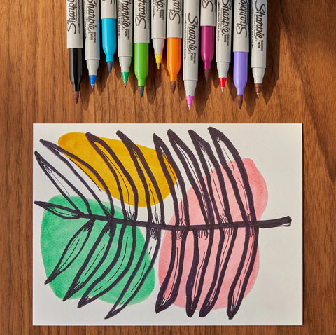 Dual Tip Permanent Markers With Brush And Ultra Fine Tips, Assorted Colors, 12 Count, artwork of leaves on paper, top view.