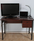 Home office desk with TV and laptop, showcasing Cord Wire Tray Desk Cable Organizer 32 Inch Open Slot Raceway To Tidy Cables Wires And Cords On Desks Office Cable Management Kit Pack Of 2 Black For Home And Office Use.