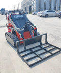 Small But Mighty Mini Skid Steer Loader With Leveler, 1800lbs capacity, on concrete, front view.