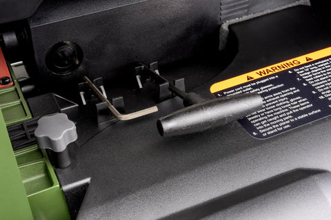 Close-up of Absolute Knockout 13 Inch Benchtop Planer showing spiral cutterhead and tool storage area.