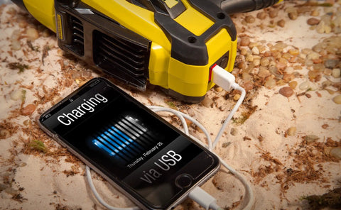 Rechargeable 2200 Lumen Lithium Ion Ultra Bright LED Spotlight Flashlight With USB Power Charger on sandy surface