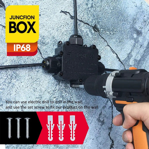 Outdoor Waterproof IP68 Junction Box With 3 Way M25 Connector being installed with a drill on a cracked wall