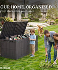 Family gardening next to 134 Gallon Waterproof Resin Deck Box With Lock Doubles As A Two Person Bench For Patio Cushions Garden Tools And Pool Gear Tough As Nails Outdoor Storage Dark Brown UV Protected