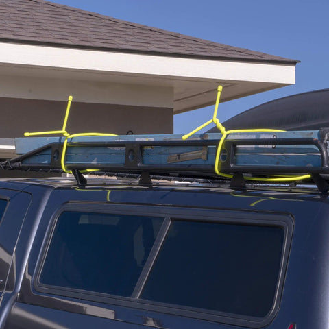 Gear Tie Mega Rubber Twist Tie 32 Inch Bright Orange securing ladder on vehicle roof rack