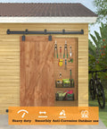8Ft Black Exterior Barn Door Hardware Kit With Heavy Duty Sliding Rail Track Wall Mount System Includes Five Brackets Supports Up To 450 Lb Doors Galvanized Steel For Durability And Corrosion Resistance Doors Not Included, installed in outdoor setting