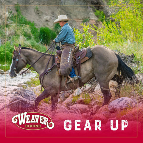 Rider on horseback wearing Black Bridle Leather Spur Straps Half Inch Wide By 19 Inches Long with darkened edges and nickel hardware