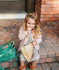 Child eating from Natural Paper Sandwich Bags With Greaseproof Barrier, 48 Count Pack, Unbleached Eco Friendly Lunch Bags outdoors