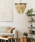 Two Tier Draped Wood Bead Chandelier In Gold Washed Metal With Ivory Beads, 10 Ft Cord And 6 Ft Chain in living room setting