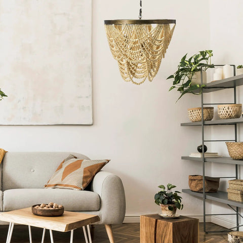 Two Tier Draped Wood Bead Chandelier In Gold Washed Metal With Ivory Beads, 10 Ft Cord And 6 Ft Chain in living room setting