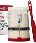 34 Oz Large Capacity Sourdough Starter Jar With Funnel Opening And Silicone Cover next to red spatula and packaging