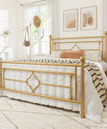 Queen Size Metal Platform Bed Frame Featuring Victorian Headboard With Gold Metallic Finish, stylishly arranged in a bright bedroom.