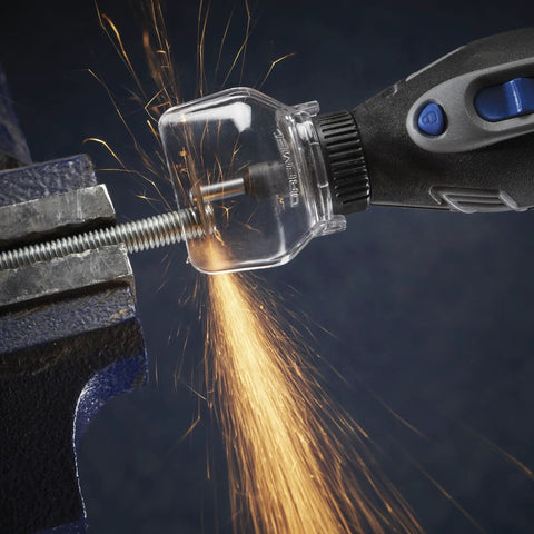 Zero Mess Spark Shield And Accessory Bundle For Rotary Tools Slick Spring Guard deflecting sparks during cutting in a vise.