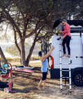 Van Telescoping Ladder With 9 Steps Extends To 8.5 Feet Easy Close System EN 131 Compliant Magnetic Fixation Kit Quick Vehicle Wall Mount Durable Aluminum Construction For Safe Roof Access And Hassle Free Day To Day Use, attached to van
