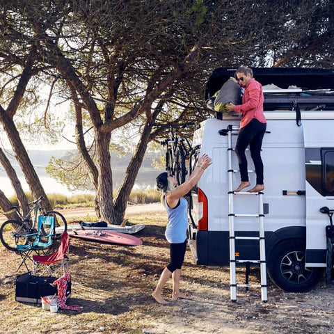 Van Telescoping Ladder With 9 Steps Extends To 8.5 Feet Easy Close System EN 131 Compliant Magnetic Fixation Kit Quick Vehicle Wall Mount Durable Aluminum Construction For Safe Roof Access And Hassle Free Day To Day Use, attached to van