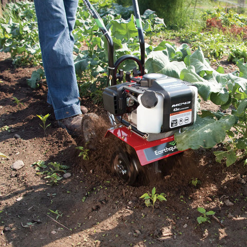 Cultivator With 43Cc 2 Cycle Viper Engine 6 To 10 Inch Adjustable Width 8 Inch Maximum Depth in use for garden tilling