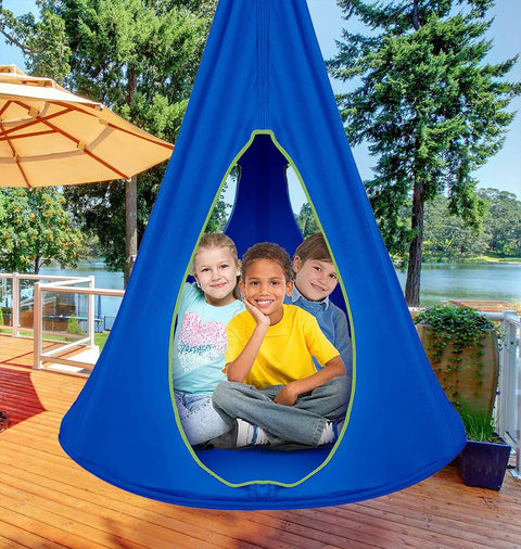 Kids Nest Swing Hammock Chair With Adjustable Rope Indoor Outdoor 40 Inch Blue Pod Swing with 3 kids inside on a wooden deck.