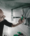 Person using Kraftform Plus 395 HO 5.5mm Nut Driver Pro Grade Hex Tool under sink for pipe tightening